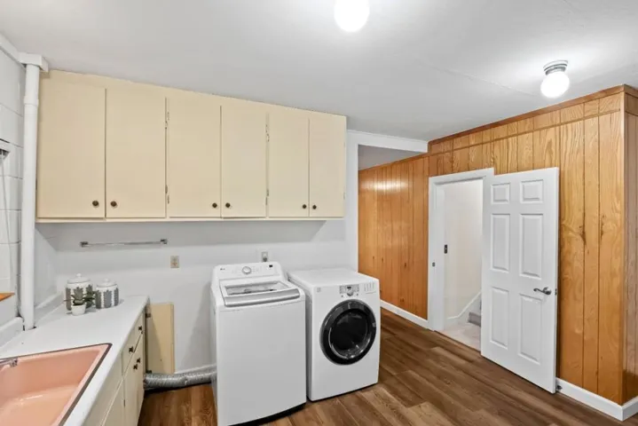 downstairs area could be used as a private guest suite; laundry shown here