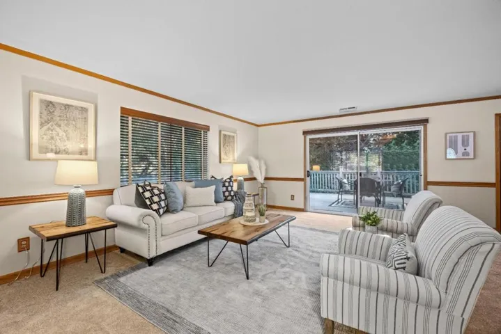 Enter the living area with views of the gorgeous trees surrounding the property