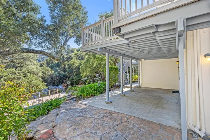 some outdoor furniture makes this shady space with covered roof an ideal spot to relax on a hot day