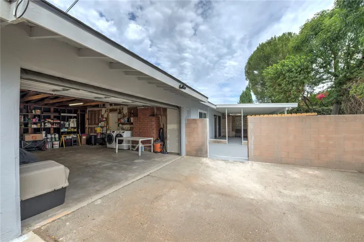 Garage and side rolling gate to backyard.