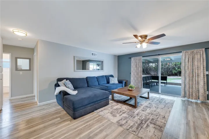 View of living room with hallway to bedrooms.