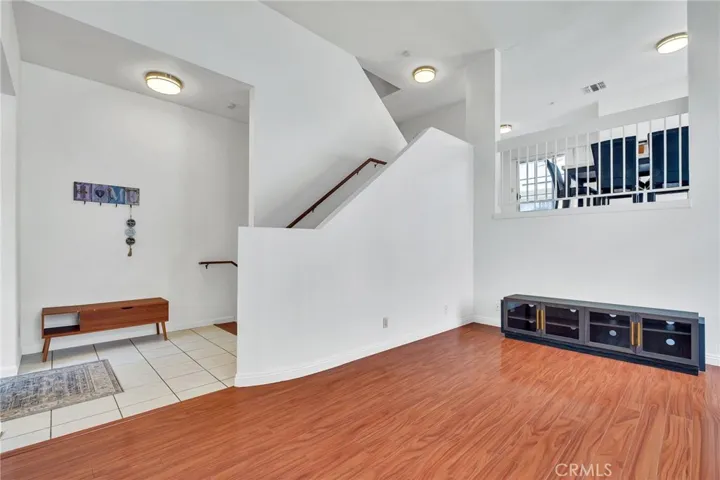 Stairs going up to the kitchen and dining area