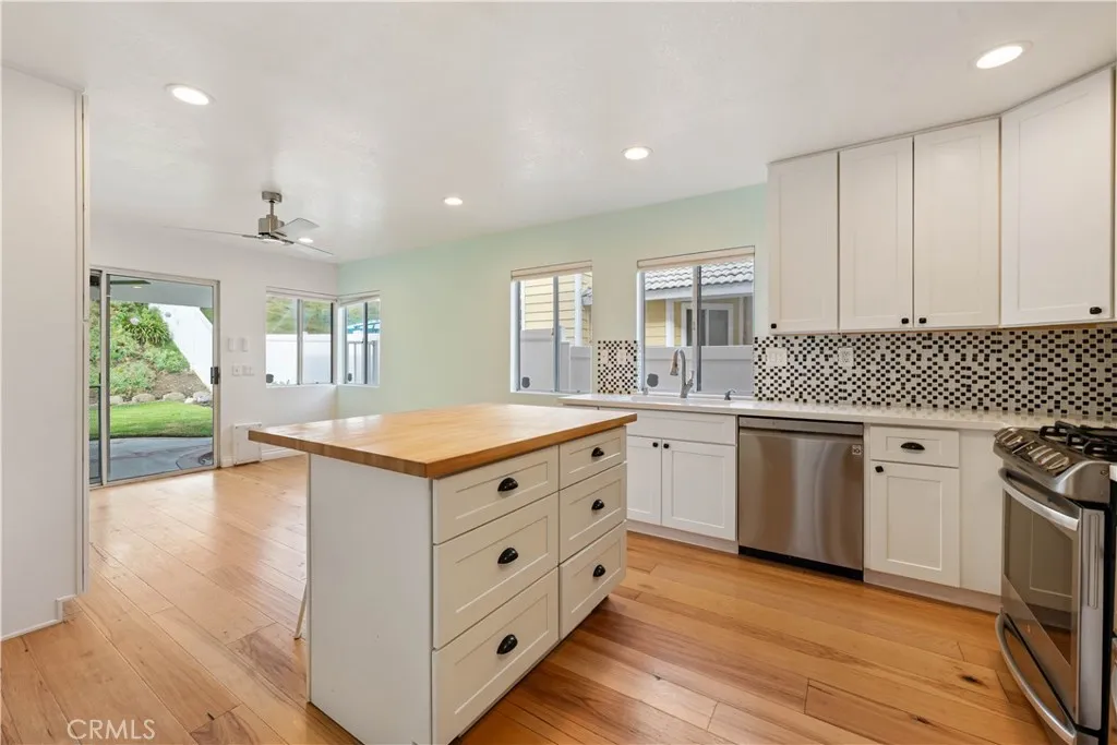 Remodeled kitchen with moveable center island w/6 storage drawers & seating.