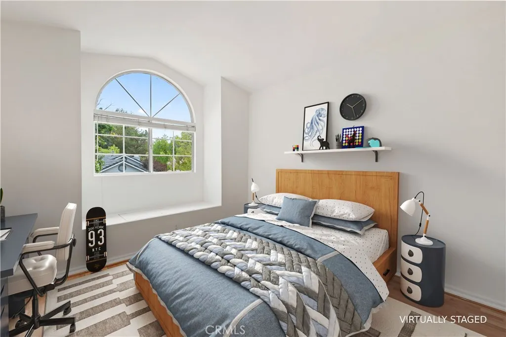 2nd bedroom with vaulted ceiling & window seat with storage