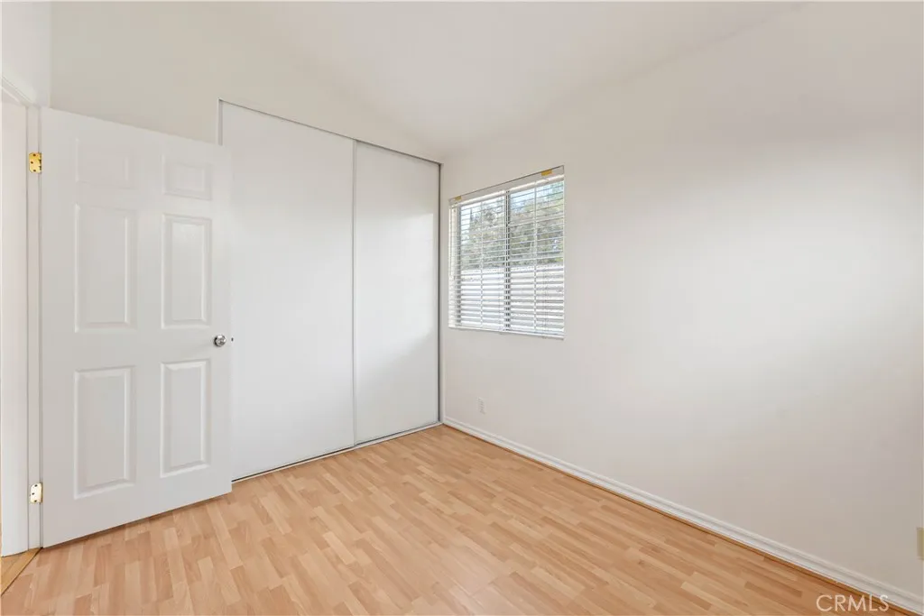 3rd bedroom with double door closet & vaulted ceiling