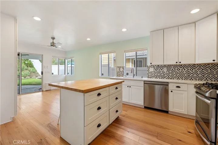 Remodeled kitchen with moveable center island w/6 storage drawers & seating.