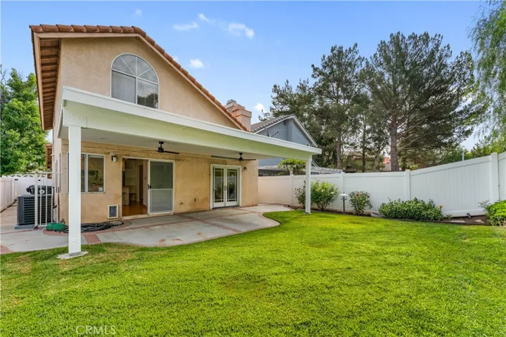 Grassy backyard to covered patio. Great for entertaining.