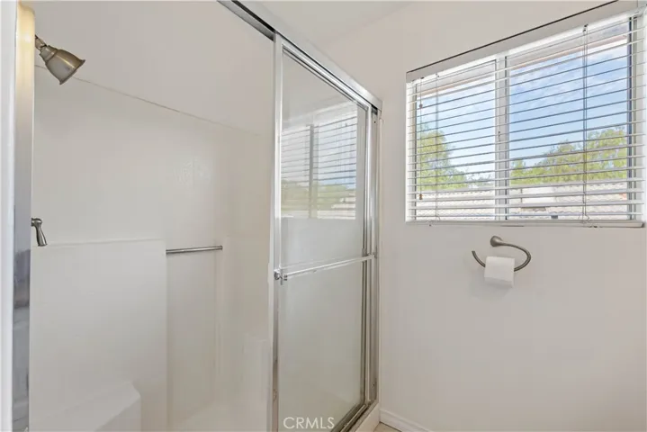 Primary bath shower with a seat.