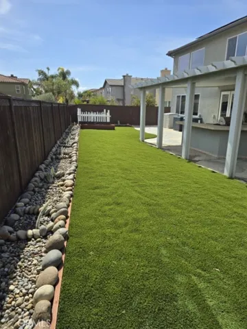 REAR ARTIFICIAL TYURF YARD AND COVERED BARAQUE PATIO