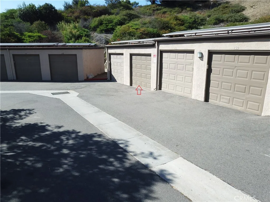 Detached spacious garage near home. Notice the foliage behind garages.  That is all hiking, biking trails.  This community is so private