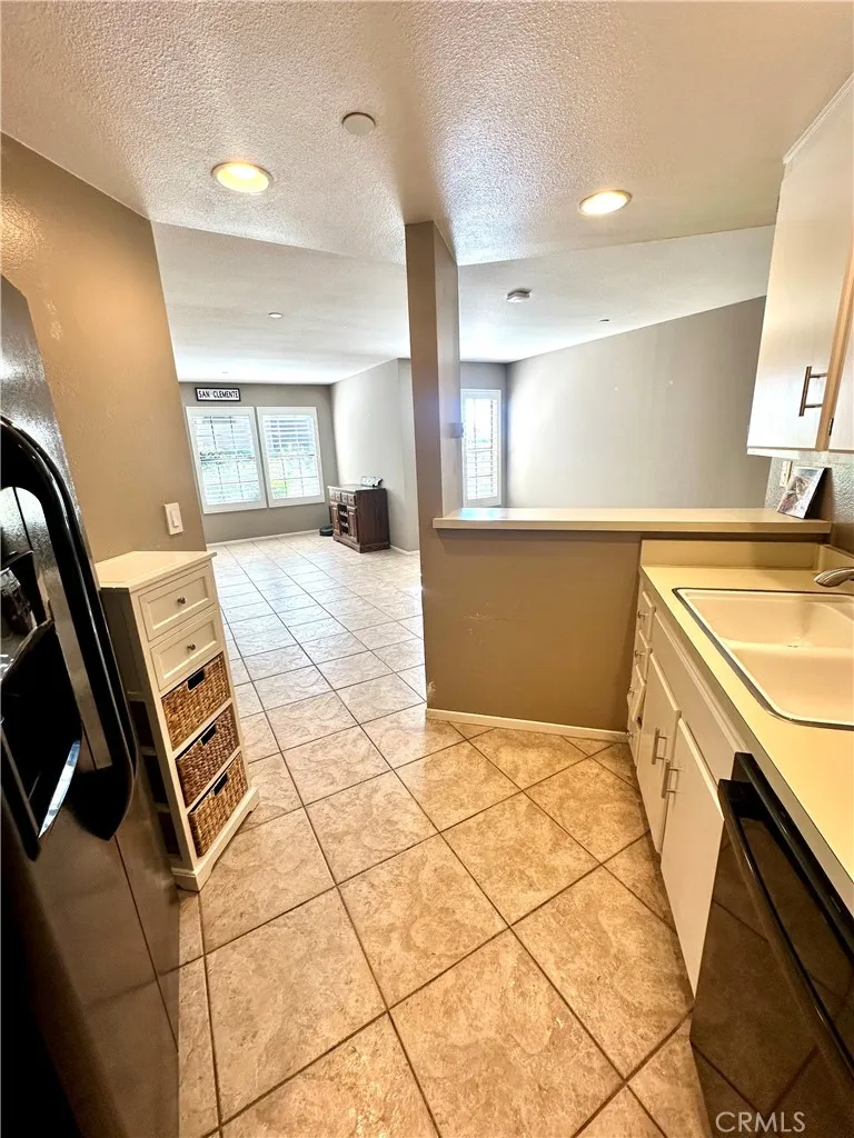 Kitchen looking to living/dining areas. Open, bright floor plan