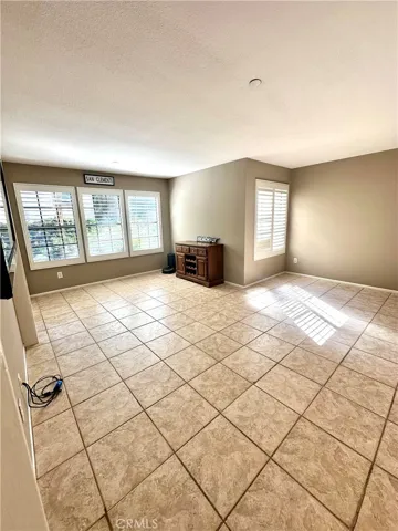 Spacious living area - windows overlook stream & get great afternoon sun