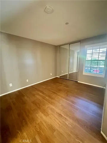 Primary bedroom with 2 closets - overlooks private patio.