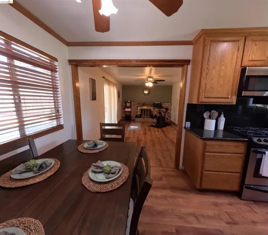 Kitchen and dining area featuring wood-finish flooring