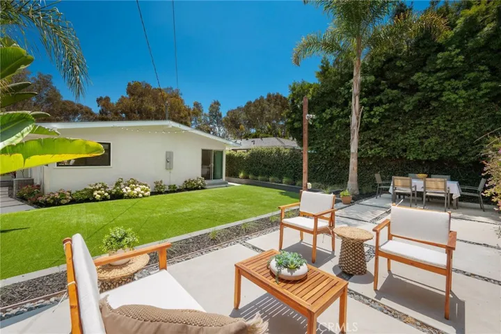 Large turfed backyard and outdoor dining area