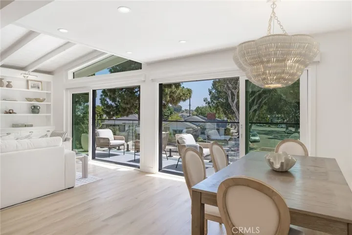 Friendly dining room with built ins and designer fixtures