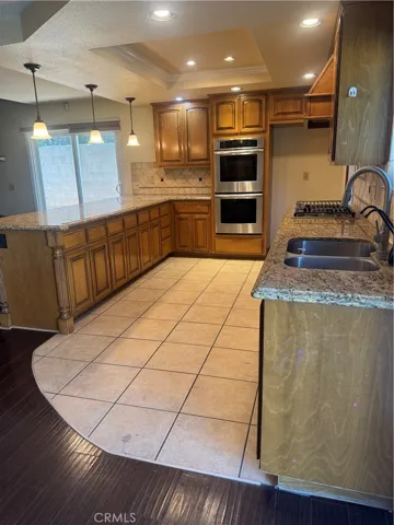Kitchen view with slide door to garage