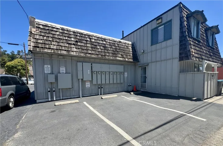 Looking from alley towards back door and parking