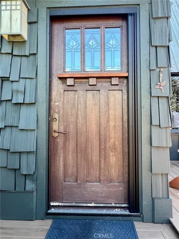 front door, outdoor patio to the right