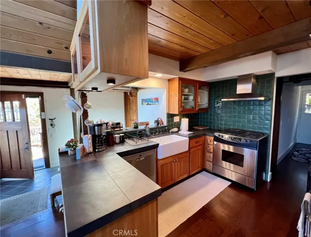 entrance to kitchen and dining bar, looking down the hallway to bedrooms and back Dutch Door, leading to back garden