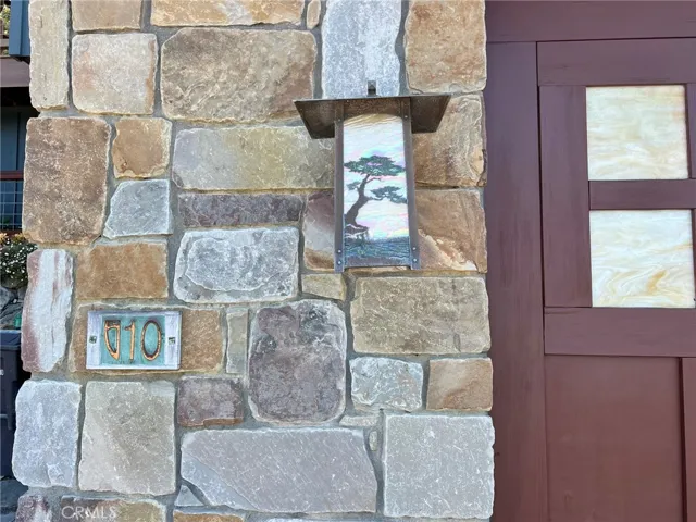 Custom fixtures and address details, stained glass garage door. The artistic style is used throughout this lovely home.