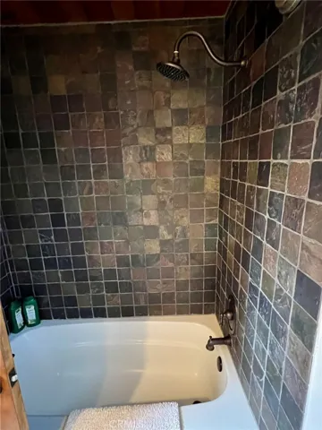 Soaking tub with shower