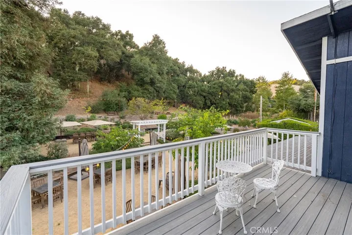 Upstairs deck overlooking back patio and event area.