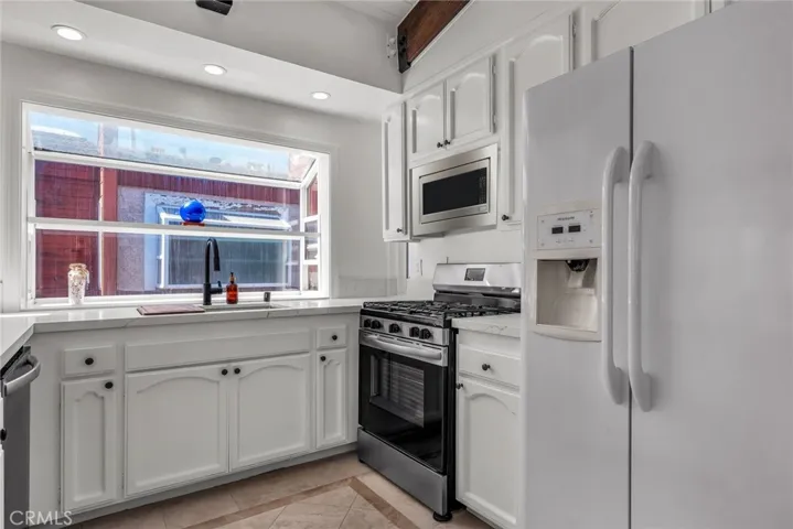 Freshly painted Kitchen cabinets Quartz counters