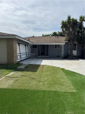 Mismatched artificial grass. Newer driveway in good condition.