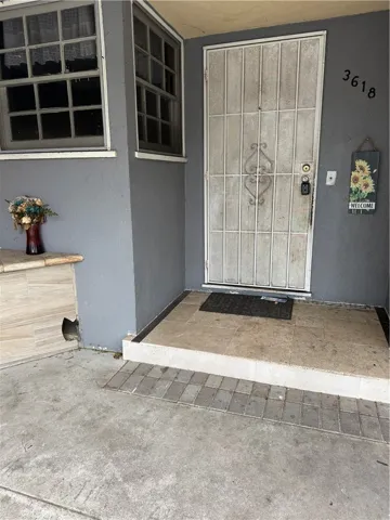 Front porch with metal security door.