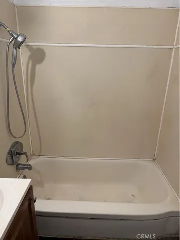 Tub with shower.