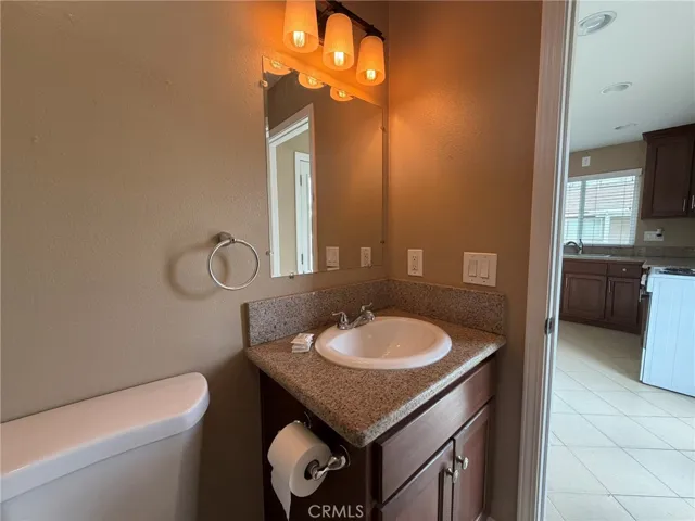 Bathroom with view of kitchen/common area