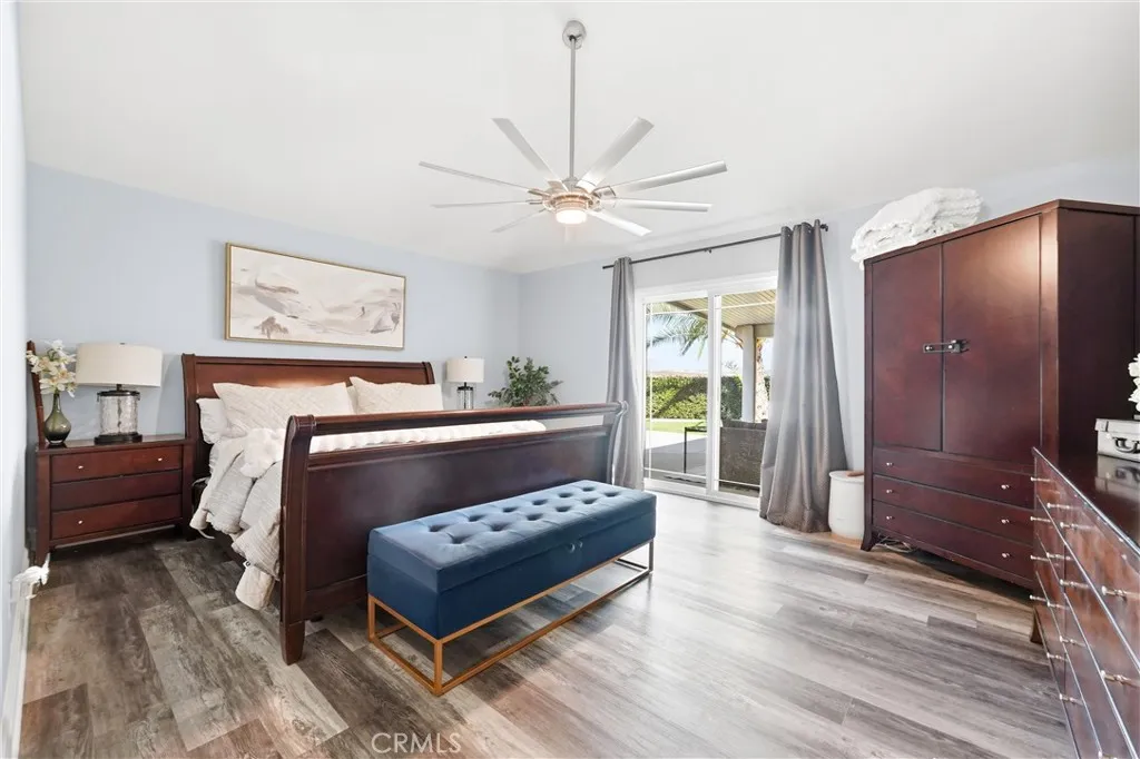 Primary bedroom with sliding door to the backyard