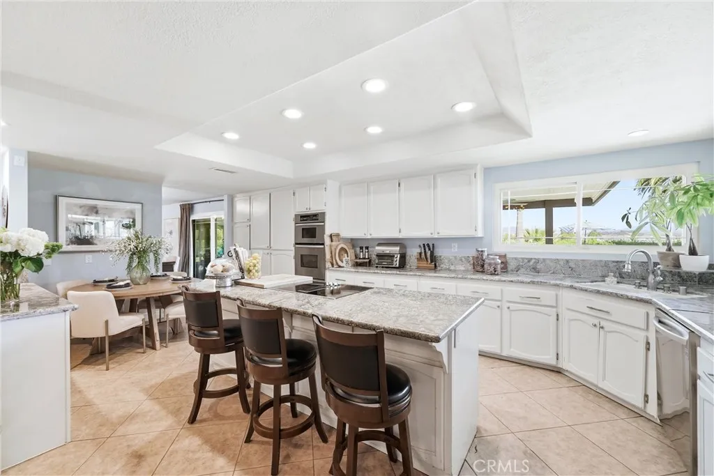 Kitchen  has a beautiful view. and a breakfast nook.