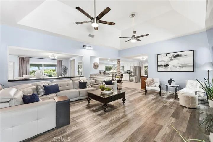 Spacious Family Room with High Ceilings and Modern Ceiling Fans