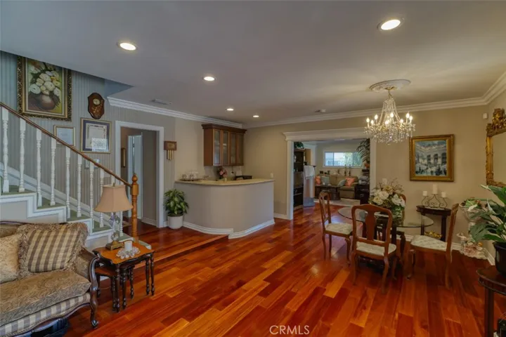 Stairs leading to primary bedroom and bathroom off family room,