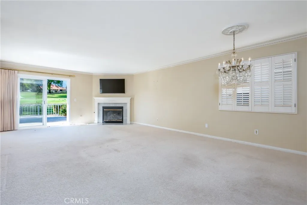 Living room with fireplace & glass slider