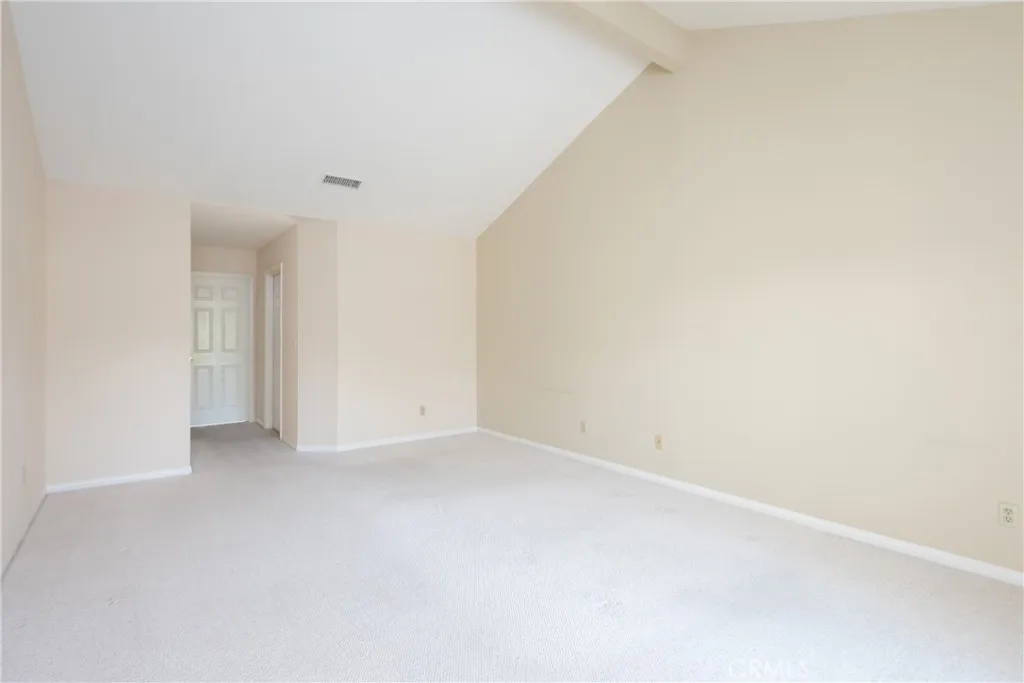 Primary bedroom with walk-in closet