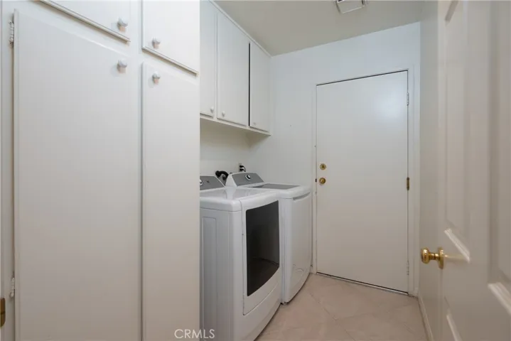 Inside laundry room with washer & dryer