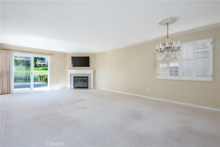 Living room with fireplace & glass slider