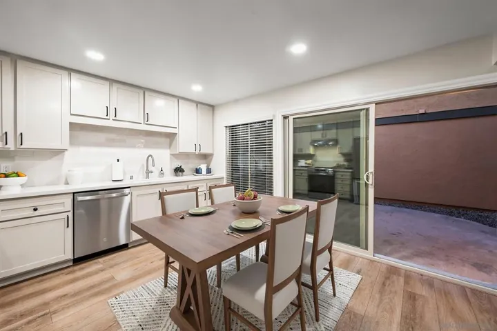 Newly remodeled, oversized, eat-in kitchen (17' x 12') with large pantry, brand-new stainless steel appliances, quartz countertops, and ceramic tile backsplash. Photo is virtually staged. See uploaded unstaged photo for reference.