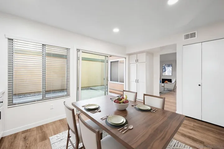 Newly remodeled, oversized, eat-in kitchen (17' x 12') with large pantry, brand-new stainless steel appliances, quartz countertops, and ceramic tile backsplash. Photo is virtually staged. See uploaded unstaged photo for reference.