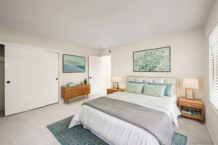 Bedroom 2: 13'x13' - Photo is virtually staged. See uploaded unstaged photo for reference.