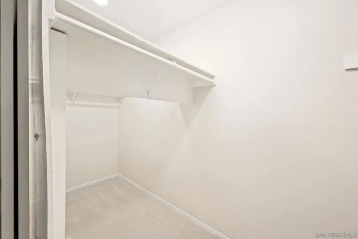 Large Primary Bedroom Suite + walk-in closet + adjacent bath - measures 16'x13': Photo is virtually staged. See uploaded unstaged photo for reference.