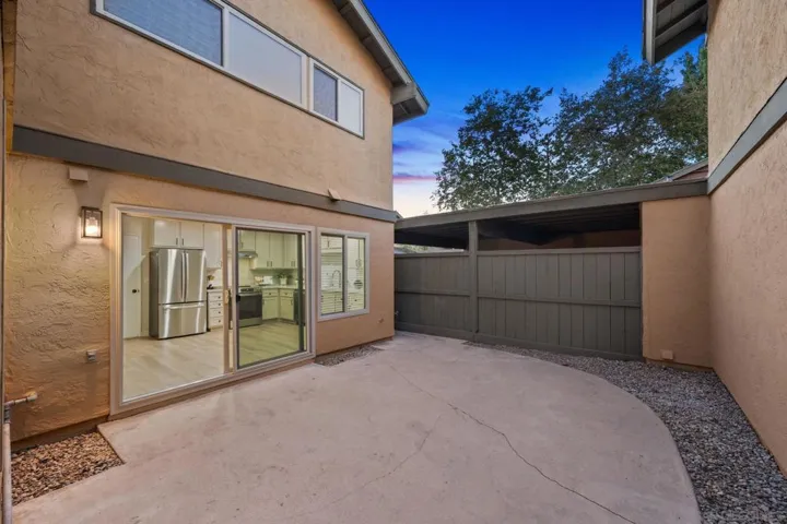 Large, fully-fenced private patio with gate access to front driveway