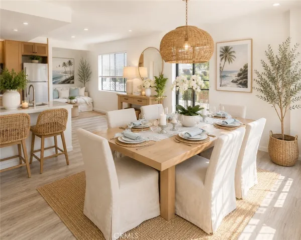 Bright dining space with breakfast bar seating and abundant natural light.