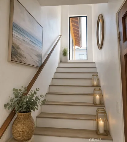 Private staircase leading to the bright and spacious second floor residence