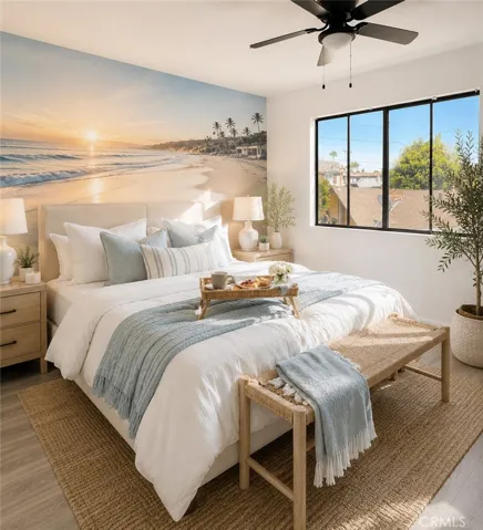Bedroom 1 featuring abundant natural light, ceiling fan, and spacious closet
