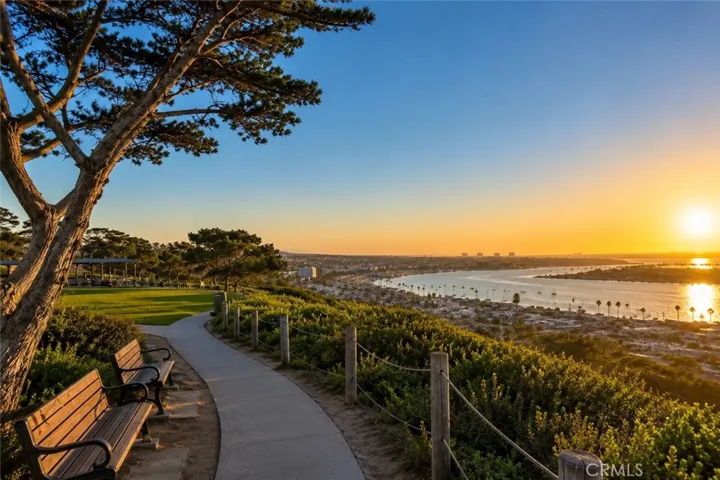 Nearby scenic overlook with walking paths, benches, and beautiful sunset views of Newport Harbor