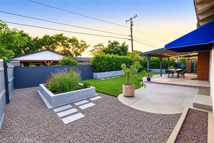 Experience the best of Southern California outdoor living in this beautifully landscaped backyard featuring a covered patio, lush lawn, and inviting spaces designed for relaxing, entertaining, and making lasting memories.